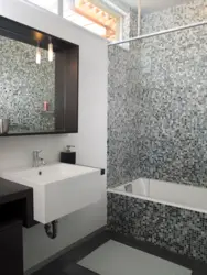 White bathtub with mosaic photo