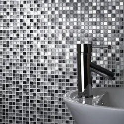 White bathtub with mosaic photo