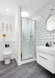 White bathroom design with shower