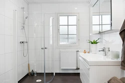 White bathroom design with shower