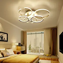 Design lamps on the ceiling in the bedroom