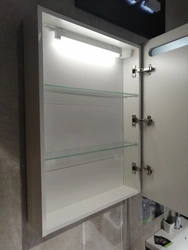 Bath cabinet with mirror and lighting photo