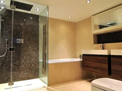 Shower next to the bath photo