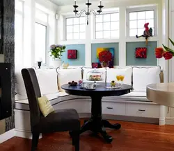 Kitchen design with sofa and dining table