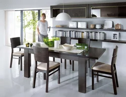 Kitchen with wooden table and chairs in the interior