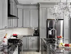 Gray kitchen with dark countertop and apron photo