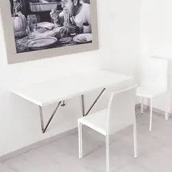 Table attached to the wall in the kitchen photo