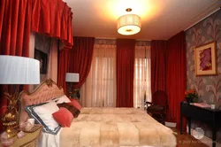 Red curtains in the bedroom interior