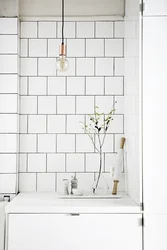 Square tiles in the bathroom interior