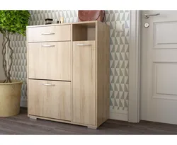 Chest of drawers with shoe rack in the hallway photo