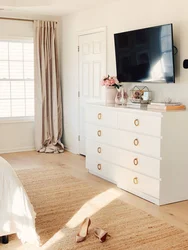 Chests of drawers in the design of a small bedroom with photos