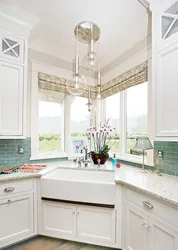 Photo of the kitchen so that the sink is near the window