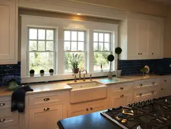 Photo of the kitchen so that the sink is near the window