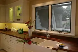 Photo of the kitchen so that the sink is near the window