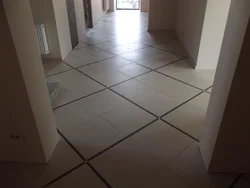 Tiles in the hallway photo on the floor and bathroom