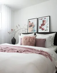 Posters in the bedroom interior above the bed