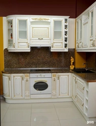 Classic white kitchen with gold patina photo