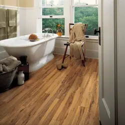 Bathtub with wooden floor photo