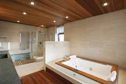 Bathtub with wooden floor photo