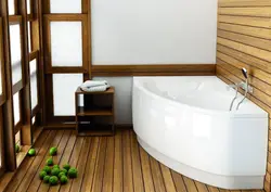 Bathtub with wooden floor photo