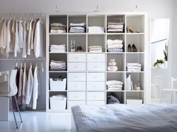 Linen closet with shelves in the bedroom photo