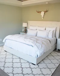 Carpet In The Bedroom Under The Bed In The Interior