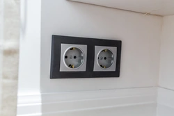 Black sockets in the kitchen interior