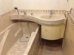 Bathtub sink above bathtub photo