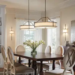 Chandelier in the living room above the table in the interior