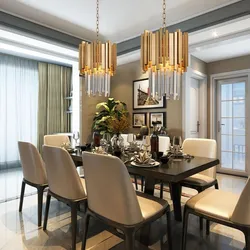 Chandelier in the living room above the table in the interior