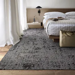 How to put a carpet in a bedroom with a bed photo