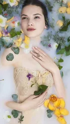 Photo in a milk bath with flowers