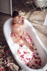 Photo In A Milk Bath With Flowers