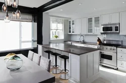 White kitchen with black table photo