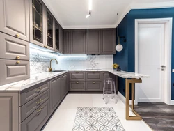 Beige kitchen with gray countertop in the interior