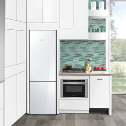 Photo of a kitchen with a white refrigerator