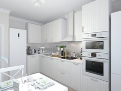 Photo of a kitchen with a white refrigerator