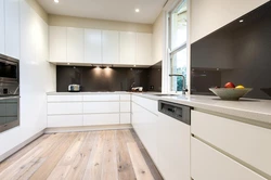 White kitchen design with brown countertops