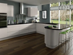 White kitchen design with brown countertops