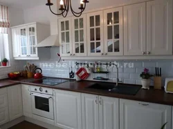 White kitchen design with brown countertops