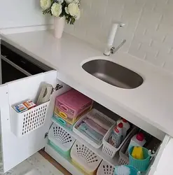 Organizing storage in the kitchen in cabinets photo