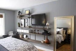 Bedroom design with tv by the window
