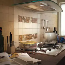 Kitchen covered in tiles up to the ceiling photo