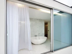 Glass doors for bathtub photo