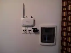 Hide the router in the hallway like on the wall photo
