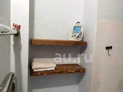 Wooden shelves in the bathroom photo