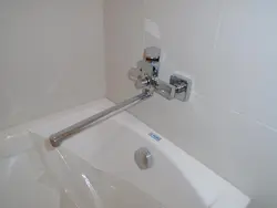 Faucet in the wall in the bathroom photo