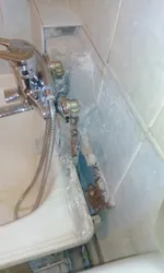 Faucet in the wall in the bathroom photo