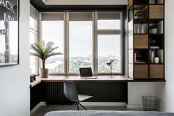 Table in the living room by the window in the interior