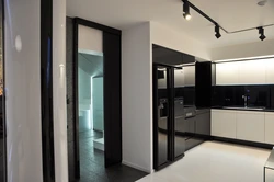 Black refrigerator in the kitchen interior